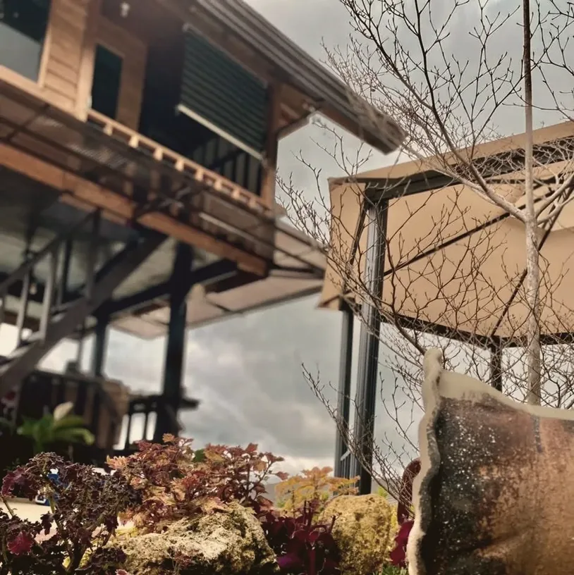 A-frame cabin nestled in lush mountain greenery at New Year's Peak Resort