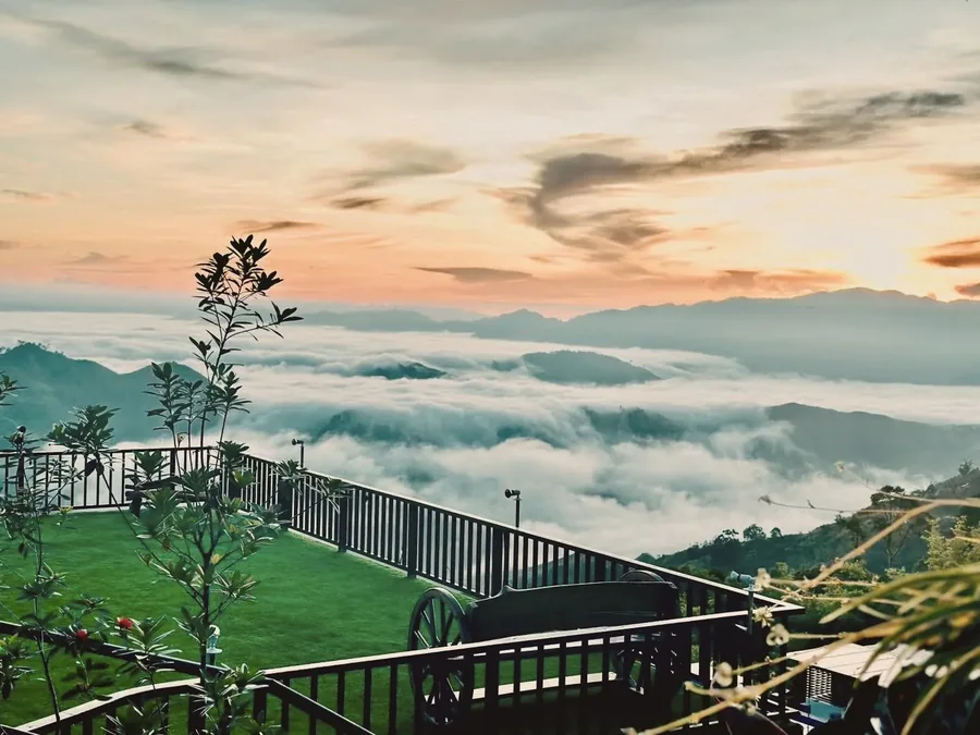 Descending staircase with sweeping valley and mountain panorama at New Year's Peak Resort