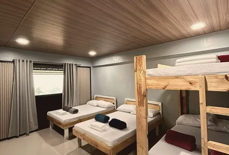 Large guest house with bunk beds and spacious common area at New Year's Peak Resort