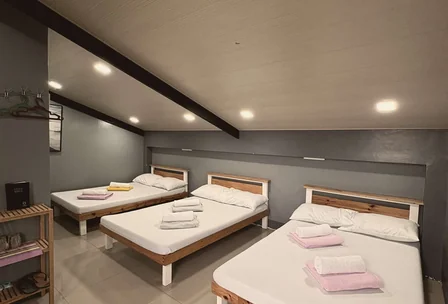 Spacious log house room with multiple beds ideal for families at New Year's Peak Resort